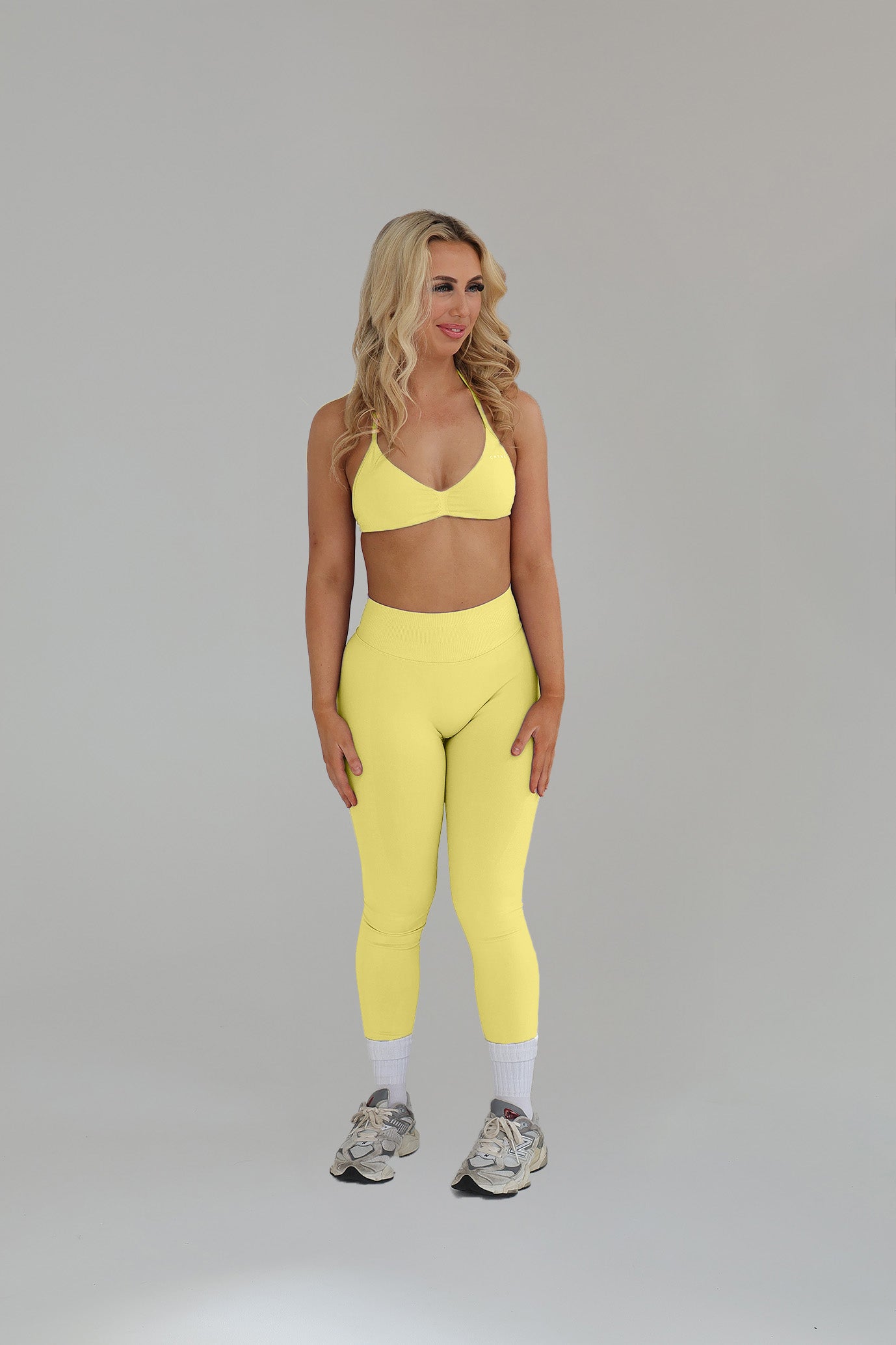 Model wearing the Daisy seamless activewear set from CNTOR the Label, featuring matching sports bra and shorts in a soft, floral-inspired tone.
