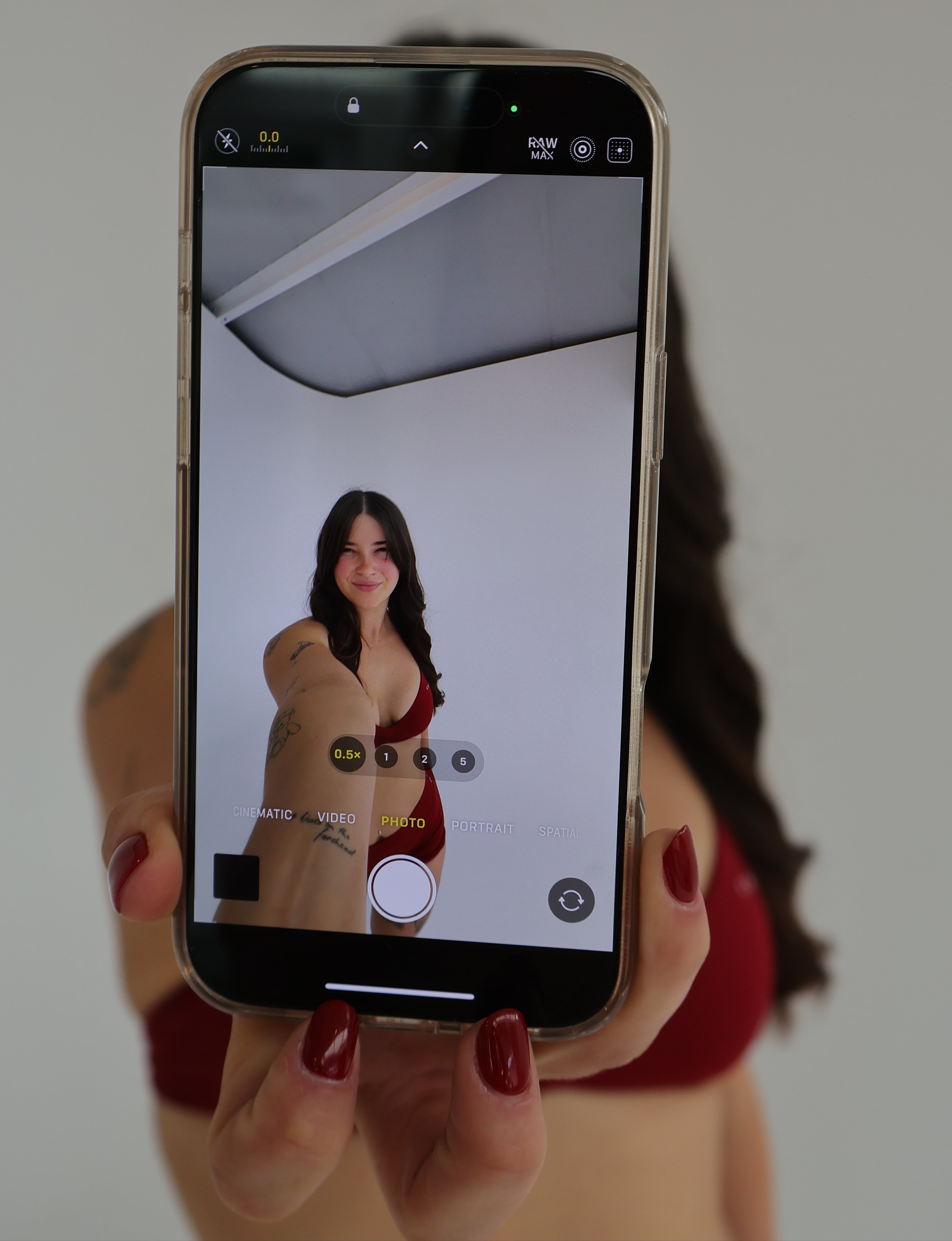 Portrait of the founder of CNTOR the Label taking a selfie, showcasing the personality behind the brand.