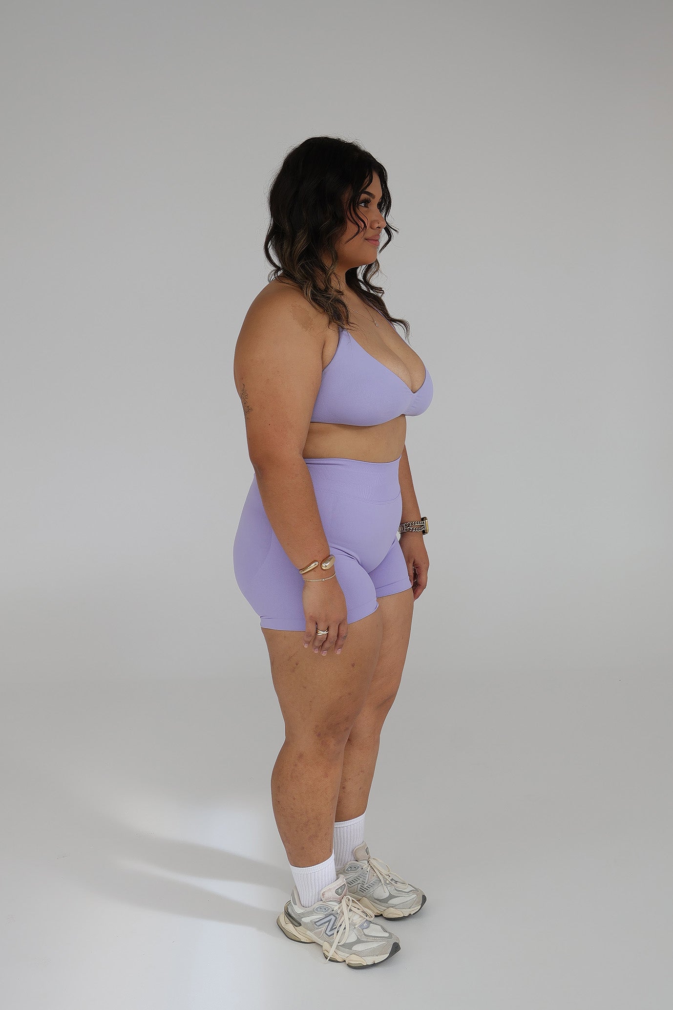 Model wearing the Lilac seamless activewear set from CNTOR the Label, featuring soft purple tones and sculpting seamless design.