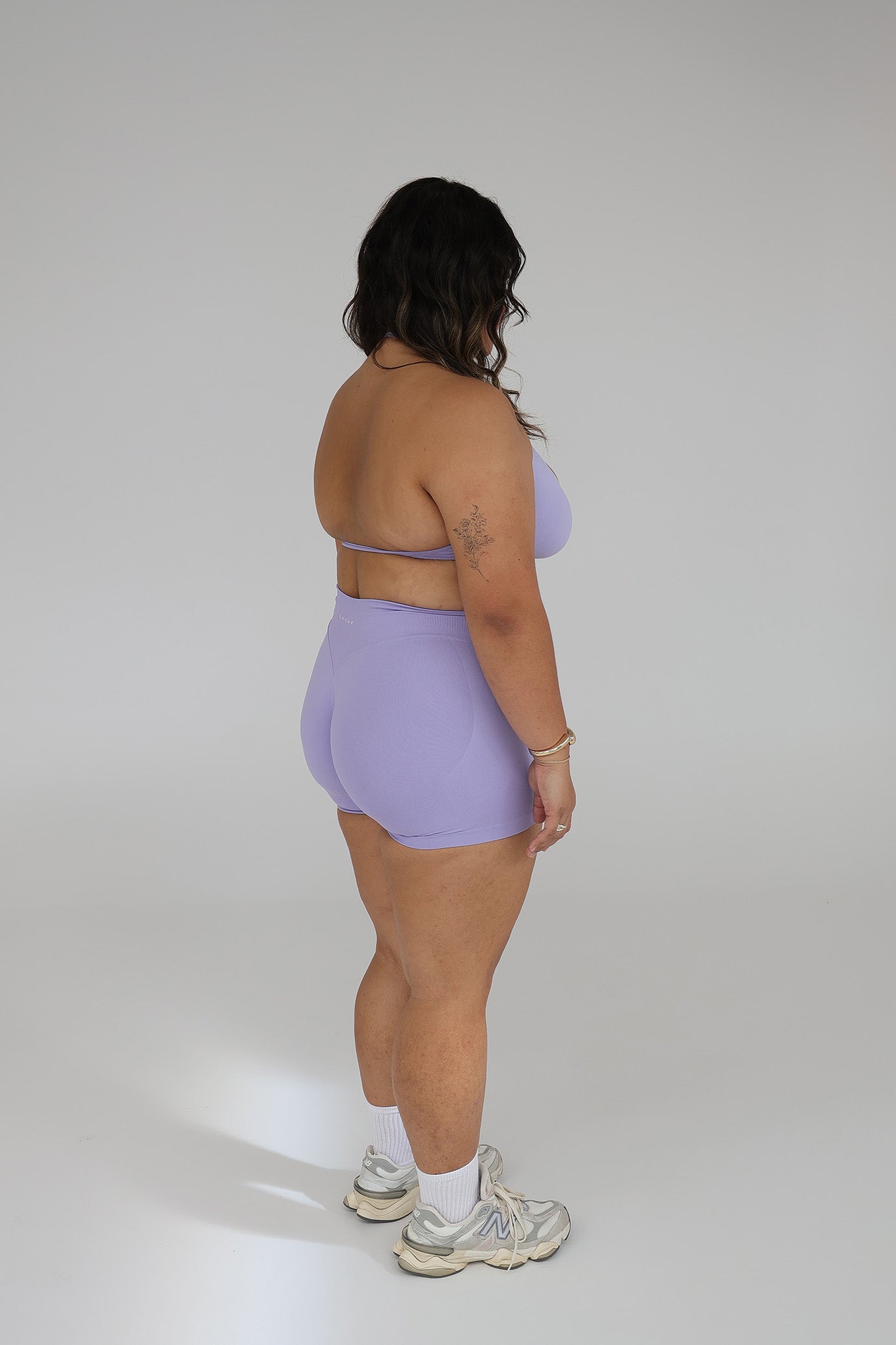 Model wearing the Lilac seamless activewear set from CNTOR the Label, featuring soft purple tones and sculpting seamless design.