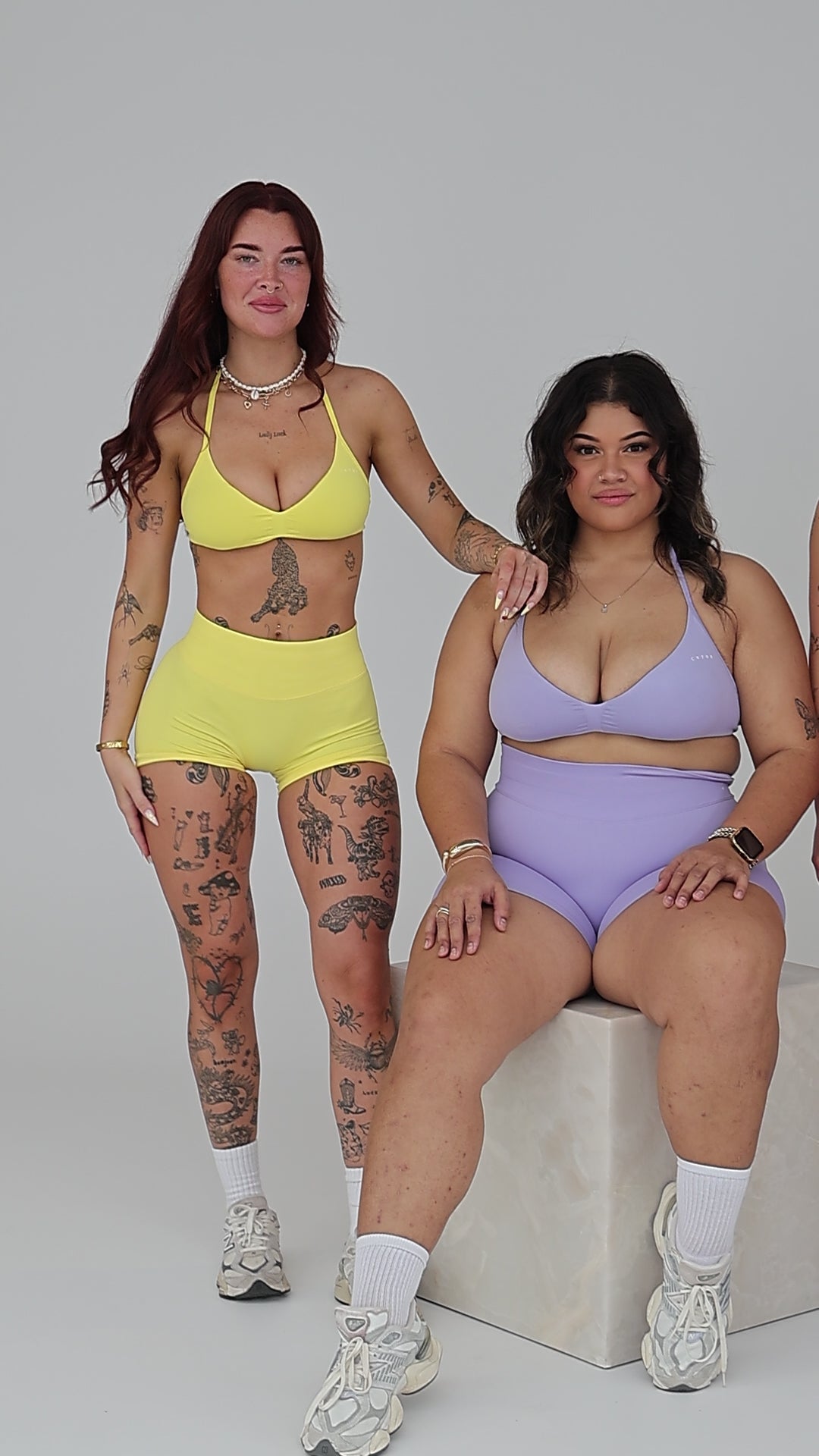 Behind-the-scenes video of CNTOR models in seamless activewear posing together for a group photo during a brand photoshoot.